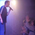 Marek sings, children cheer enthusiastically.