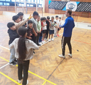 Children line up at the start of soccer practice.