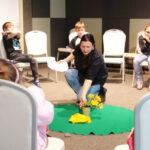 As she begins the Easter story, Denisa is setting up some themed decorations. This time, she’s talking with children younger than seventh-graders.