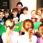 And here, too, the children are working together to keep the ball on the taut canvas.