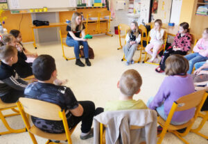 Miriam invites the children to hear the Easter story.
