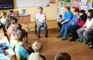 The class listens attentively to the program.